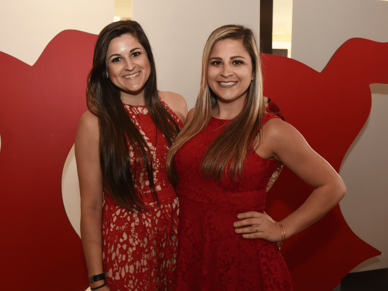 Amanda Tinney (left) and sister, Kelli Tinney, at the 2018 Go Red For Women luncheon in New Orleans. (Photo courtesy of Jeff Strout Photography)